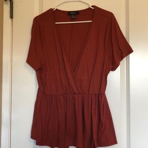 Burnt orange low cut blouse